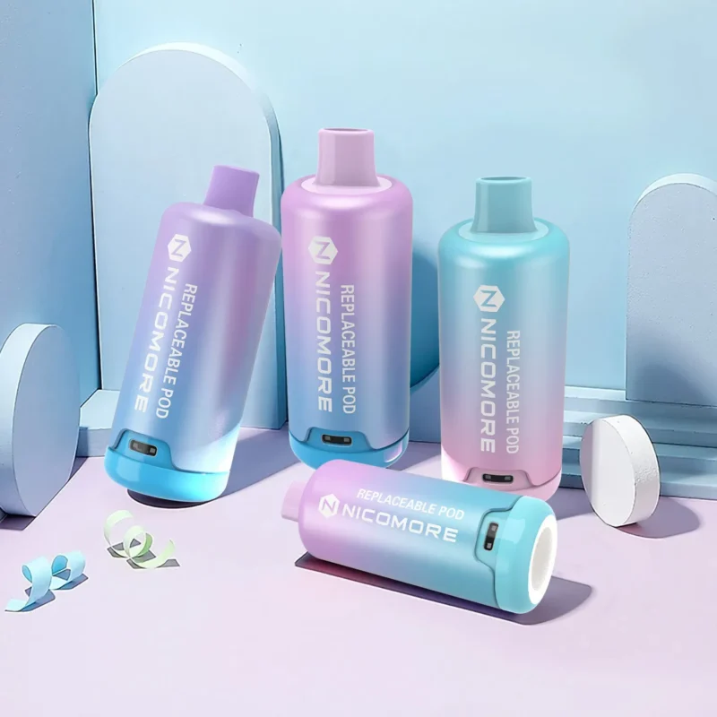 Nicomore replaceable pods in pink and blue, displayed against a minimalistic background."